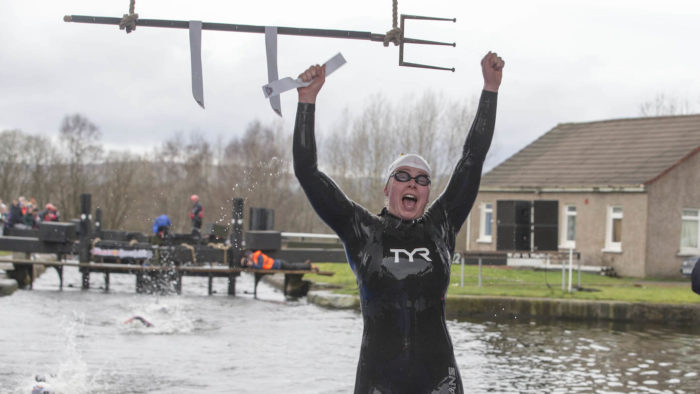 Womens winner Jennifer Davies crosses the finish line at the 3rd Red Bull Neptune Steps in Glasgow on March 18, 2017