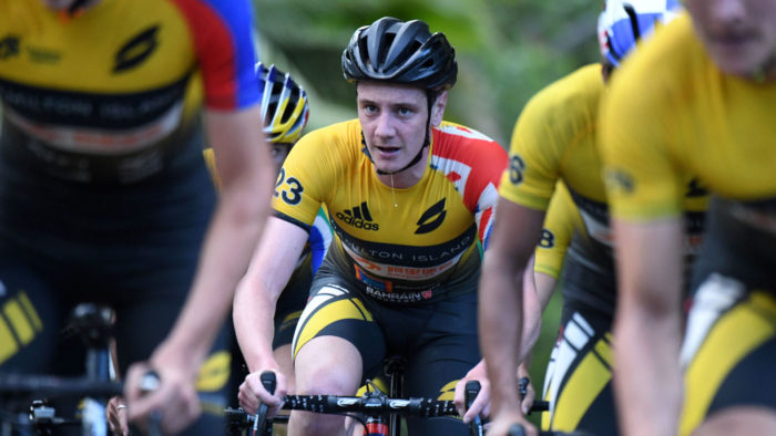 Alistair Brownlee grimaces with the hard-charging peloton (Delly Carr)