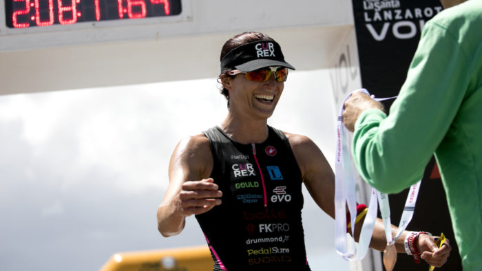 Alice Hector receives her medal from Volcano Triathlon Race Director Kenneth Gasque