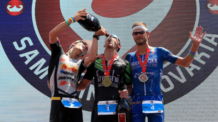 BRATISLAVA, SLOVAKIA - JUNE 3: Lionel Sanders (C) of Canada celebrates winning with second place Sebastian Kienle of Germany (L) and third place Michael Raelert of Germany (R) The Championship Challenge Triathlon on June 3, 2017 in Bratislava, Slovakia. (Photo by Stephen Pond/Getty Images for Challenge Triathlon) *** Local Caption *** Lionel Sanders; Sebastian Kienle; Michael Raelert