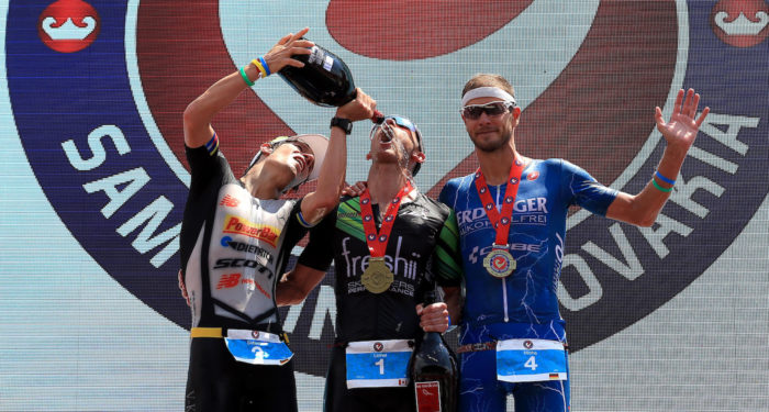 BRATISLAVA, SLOVAKIA - JUNE 3: Lionel Sanders (C) of Canada celebrates winning with second place Sebastian Kienle of Germany (L) and third place Michael Raelert of Germany (R) The Championship Challenge Triathlon on June 3, 2017 in Bratislava, Slovakia. (Photo by Stephen Pond/Getty Images for Challenge Triathlon) *** Local Caption *** Lionel Sanders; Sebastian Kienle; Michael Raelert