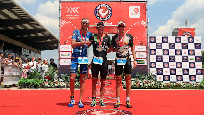 BRATISLAVA, SLOVAKIA - JUNE 3: Lionel Sanders (C) of Canada celebrates winning with second place Sebastian Kienle of Germany (R) and third place Michael Raelert of Germany (L) The Championship Challenge Triathlon on June 3, 2017 in Bratislava, Slovakia. (Photo by Stephen Pond/Getty Images for Challenge Triathlon) *** Local Caption *** Lionel Sanders; Sebastian Kienle; Michael Raelert