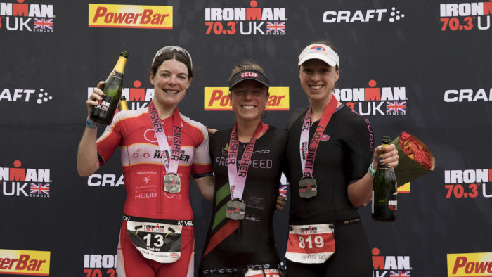 SOMERSET, UNITED KINGDOM - JUNE 25: Second place athlete Elaine Garvican (L), first place athlete Ruth Purbrook and third pace athlete Heather Fell (R), all of them from Great Britain pose for a picture at the top three podium during the Ironman 70.3 UK Exmoor at Wimbleball Lake on June 25, 2017 in Somerset, United Kingdom. (Photo by Gonzalo Arroyo Moreno/Getty Images for Ironman)