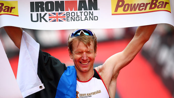 BOLTON, ENGLAND - JULY 17: Kirill Kotsegarov of Estonia crosses the line to win the mens race during the Ironman UK on July 17, 2016 in Bolton, England. (Photo by Charlie Crowhurst/Getty Images)