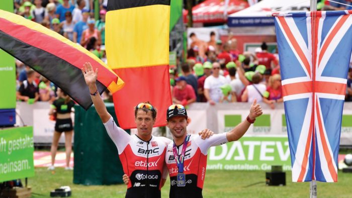 ROTH, GERMANY - JULY 09: Maurice Clavel of Germany (l) and Bart Aernouts of Belgium celebrate the winning of the DATEV Challenge Roth 2017 on July 9, 2017 in Roth, Germany. 5000 athletes are competing in todays race and 260,000 spectators watching the challenge. (Photo by Alexander Koerner/Getty Images)