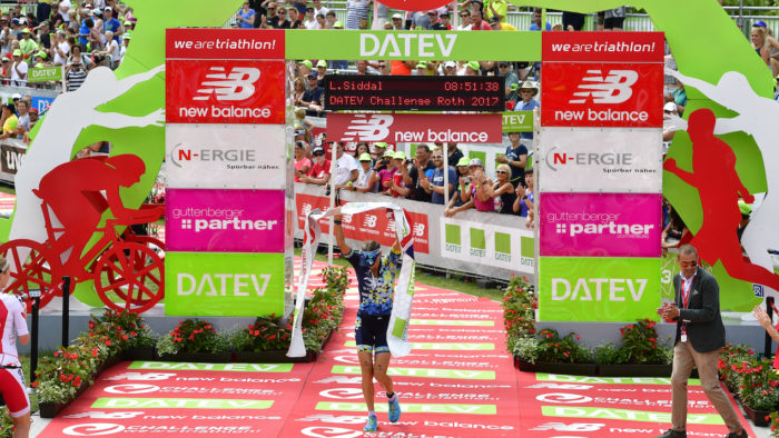 ROTH, GERMANY - JULY 09: Laura Siddal of Great Britain celebrates her second place of the DATEV Challenge Roth 2017 on July 9, 2017 in Roth, Germany. 5000 athletes compete in todays race and 260.000 spectators watched the challenge. (Photo by Alexander Koerner/Getty Images)