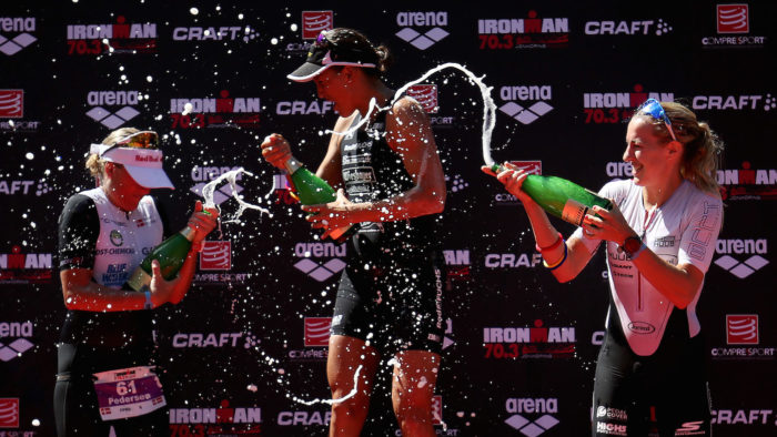 JONKOPING, SWEDEN - JULY 09: Lisa Huetthaler (C) of Germany celebrates winning the Women's race at Ironman 70.3 Jonkoping with Camilla Pedersen (L) of Denmark second and Kimberley Morrison (R) of Britain third on July 9, 2017 in Jonkoping, Sweden. (Photo by Nigel Roddis/Getty Images for Ironman)