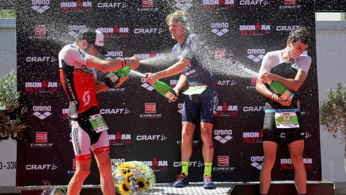 JONKOPING, SWEDEN - JULY 09: Josh Amberger (C) of Australia celebrates winning Ironman 70.3 Jonkoping with Adrian Haller (L) of Switzerland second and Markus Herbst (R) of Germany third on July 9, 2017 in Jonkoping, Sweden. (Photo by Nigel Roddis/Getty Images for Ironman)