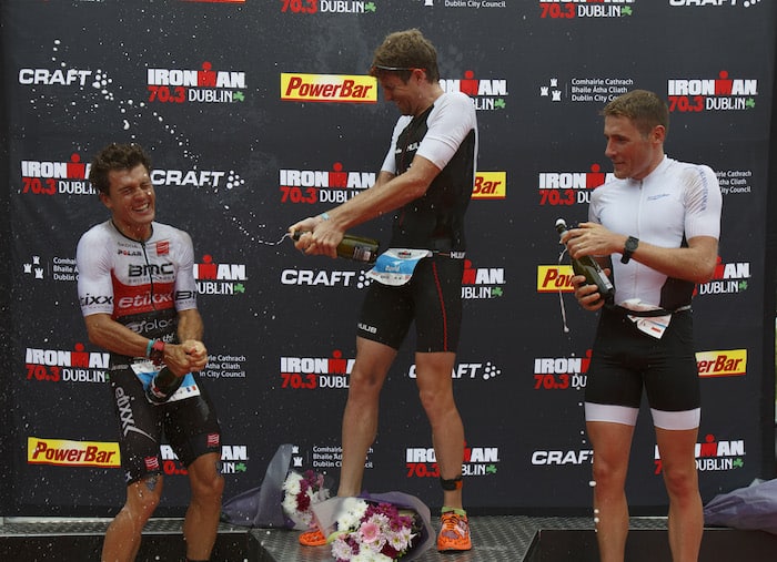 DUBLIN, IRELAND - AUGUST 20: Athlete David McNamee from Great Britain celebrates winning the men race of IRONMAN 70.3 Dublin with Romain Guillaume from France (L) second and Sean Donnelly from Germany (R) third at the finish line on August 20, 2017 in Dublin, Ireland. (Photo by Pablo Blazquez Dominguez/Getty Images for IRONMAN)