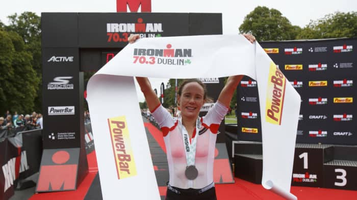 DUBLIN, IRELAND - AUGUST 20: Athlete Sarah Lewis from Great Britain celebrates winning the women race of IRONMAN 70.3 Dublin triathlon at the finish line on August 20, 2017 in Dublin, Ireland. (Photo by Pablo Blazquez Dominguez/Getty Images for IRONMAN)