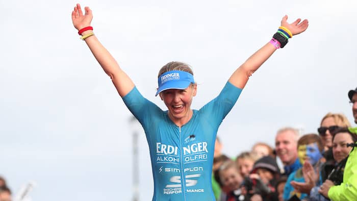 TENBY, WALES - SEPTEMBER 10: Lucy Gossard of Great Britain celebrates with the crowd after she finishes first in the Women's race during the Ironman Wales competiton on September 10, 2017 in Tenby, Wales. (Photo by Ian MacNicol/Getty Images for IRONMAN)