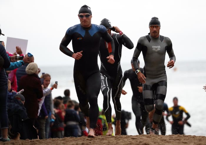 TENBY, WALES - SEPTEMBER 10: Athletes compete in the swim leg of IRONMAN Wales on September 10, 2017 in Tenby, Wales. (Photo by Bryn Lennon/Getty Images for IRONMAN)