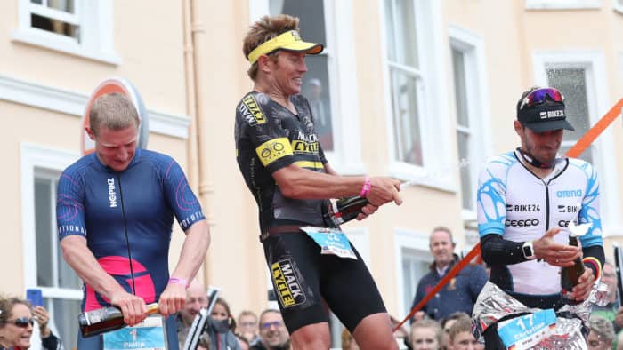 TENBY, WALES - SEPTEMBER 10: Cameron Wurf of Australia celebrates on the podium after he wins the Men's race during the Ironman Wales competiton on September 10, 2017 in Tenby, Wales. (Photo by Ian MacNicol/Getty Images for IRONMAN)