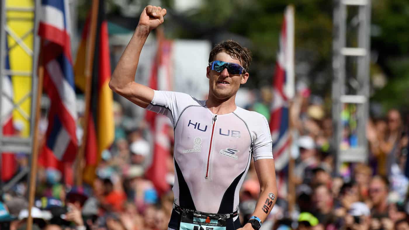 KAILUA KONA, HI - OCTOBER 13: David McNamee of Great Britain celebrates finishing third with a time of 8:01:09 during the IRONMAN World Championships brought to you by Amazon on October 13, 2018 in Kailua Kona, Hawaii. (Photo by Nils Nilsen/Getty Images for IRONMAN)