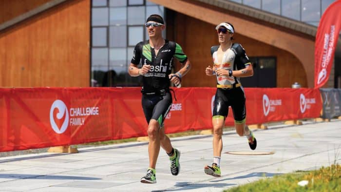 BRATISLAVA, SLOVAKIA - JUNE 3: Lionel Sanders of Canada and Sebastian Kienle of Germany contest first place on the run course during The Championship Challenge Triathlon on June 3, 2017 in Bratislava, Slovakia. (Photo by Stephen Pond/Getty Images for Challenge Triathlon)