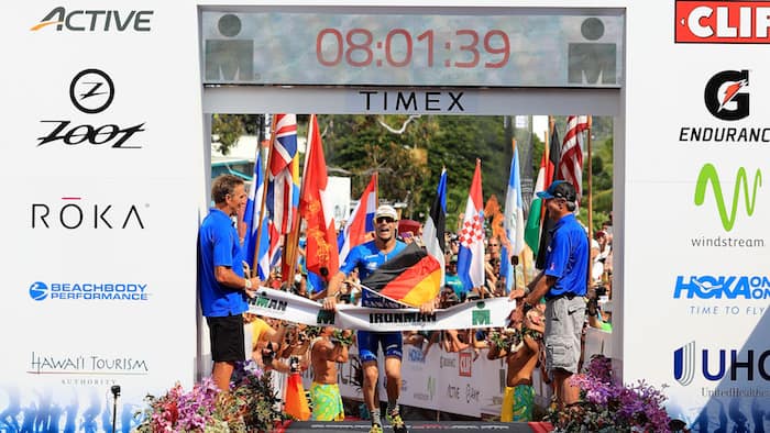 KAILUA KONA, HI - OCTOBER 14: Patrick Lange of Germany celebrates afer winning the IRONMAN World Championship and setting a course record of 8:01.39 beating Craig Alexander's 2011 record of 8:03.56 on October 14, 2017 in Kailua Kona, Hawaii. (Photo by Sean M. Haffey/Getty Images for IRONMAN)