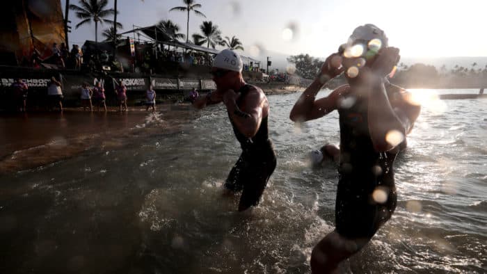 KAILUA KONA, HI - OCTOBER 14: Swimmers get out of the water during the IRONMAN World Championship on October 14, 2017 in Kailua Kona, Hawaii. (Photo by Tom Pennington/Getty Images for IRONMAN)