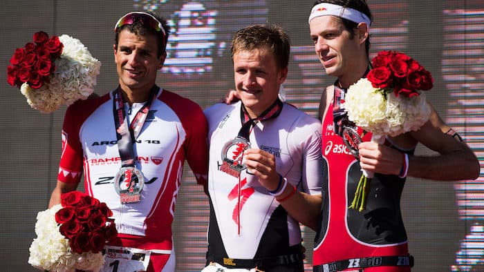 BAHRAIN, BAHRAIN - NOVEMBER 25: Kristian Blummenfelt (C) of Norway in 1st place, Terenzo Bozzone (L) of New Zealand in 2nd place and Sven Riederer (R) of Switzerland in 3rd place celebrate their positions in the men's race of IRONMAN 70.3 Middle East Championship Bahrain on November 25, 2017 in Bahrain, Bahrain. (Photo by Alex Caparros/Getty Images for IRONMAN)