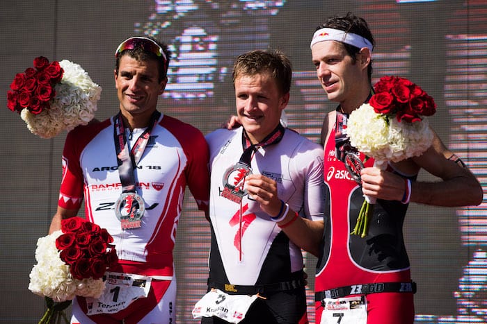 BAHRAIN, BAHRAIN - NOVEMBER 25: Kristian Blummenfelt (C) of Norway in 1st place, Terenzo Bozzone (L) of New Zealand in 2nd place and Sven Riederer (R) of Switzerland in 3rd place celebrate their positions in the men's race of IRONMAN 70.3 Middle East Championship Bahrain on November 25, 2017 in Bahrain, Bahrain. (Photo by Alex Caparros/Getty Images for IRONMAN)