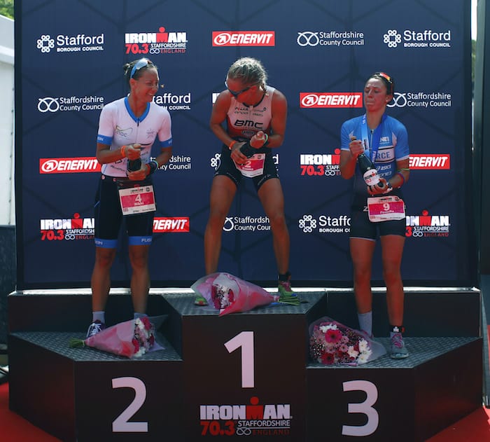 LICHFIELD, ENGLAND - JUNE 10: Emma Pallant of Great Britain celebrates as she wins the womens pro race with Nikki Bartlett and Fenella Langridge during the IRONMAN 70.3 Staffordshire on June 10, 2018 in Lichfield, England. (Photo by Charlie Crowhurst/Getty Images for IRONMAN)