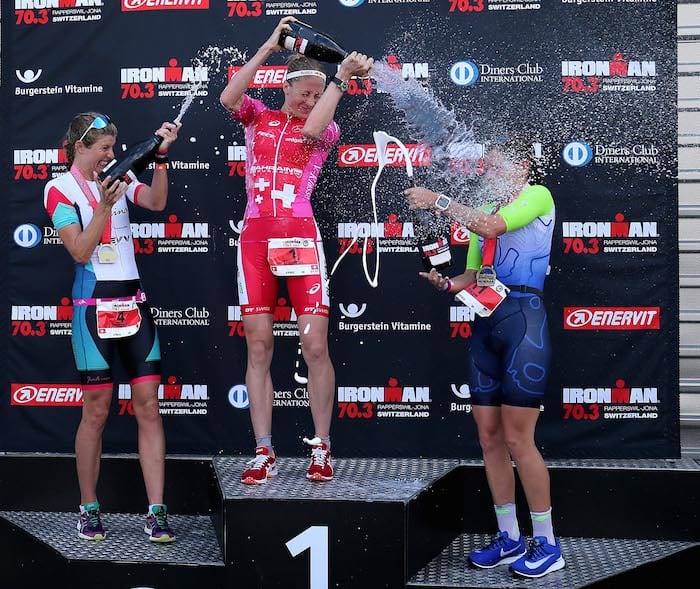 JONA, SWITZERLAND - JUNE 10: Daniela Ryf of Switzerland (C) 1st, Imogen Simmonds of Switzerland (L) 2nd and Skye Moench of USA 3rd celebrate on the podium after Ironman 70.3 Switzerland Rapperswil-Jona on June 10, 2018 in Jona, Switzerland. (Photo by Nigel Roddis/Getty Images for IRONMAN)