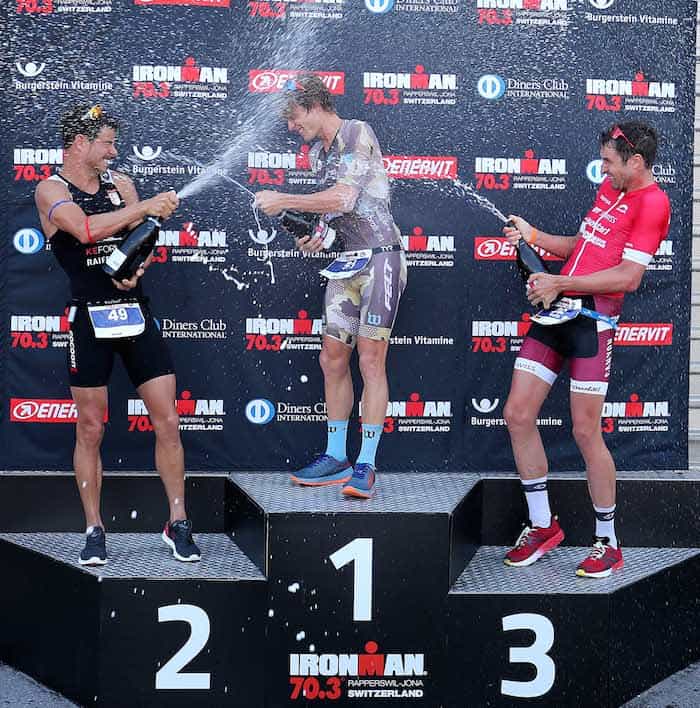 JONA, SWITZERLAND - JUNE 10: Josh Amberger of Australia (C) 1st, Manuel Kueng of Switzerland (L) 2nd and Boris Stein of Germany 3rd celebrate on the podium of Ironman 70.3 Switzerland Rapperswil-Jona on June 10, 2018 in Jona, Switzerland. (Photo by Nigel Roddis/Getty Images for IRONMAN)