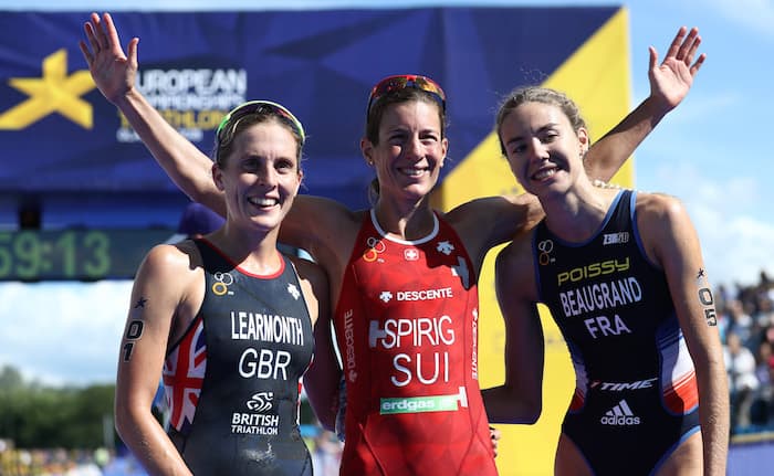 GLASGOW, SCOTLAND - AUGUST 09: Bronze medalist Cassandre Beaugrand of France, Silver medalist Jess Learmonth of Great Britain, and Gold medalist Nicola Spirig of Switzerland celebrate after the Women's triathlon during the triathlon on Day eight of the European Championships Glasgow 2018 at Strathclyde Country Park on August 9, 2018 in Glasgow, Scotland. This event forms part of the first multi-sport European Championships. (Photo by Bryn Lennon/Getty Images)