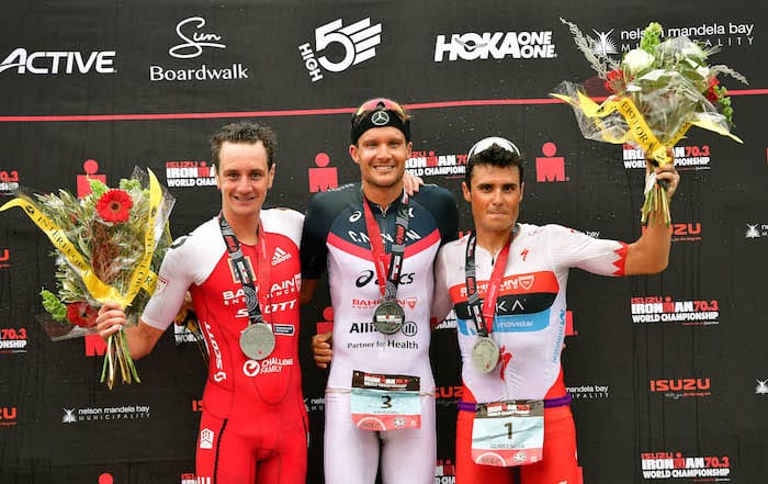 PORT ELIZABETH - SEPTEMBER 2: (L-R) Winner Podium of 2nd Place Alistair Brownlee of Great Britain, 1st Place Jan Frodeno of Germany and 3rd Place Javier Gomez Noya of Spain celebrate on the winner's podium during the Isuzu IRONMAN 70.3 World Championship Men in Port Elizabeth, South Africa on September 2, 2018. Over 4,500 athletes from over 100 countries will be represented in this years 70.3 World Championship. (Photo by Donald Miralle/Getty Images for IRONMAN).