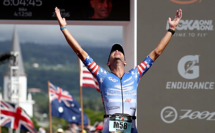 KAILUA KONA, HI - OCTOBER 13: Matt Russell of the United States celebrates after crossing the finish line during the IRONMAN World Championships brought to you by Amazon on October 13, 2018 in Kailua Kona, Hawaii. (Photo by Al Bello/Getty Images for IRONMAN)