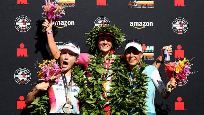 KAILUA KONA, HI - OCTOBER 13: Lucy Charles of Great Britain (second), Daniela Ryf of Switzerland (first) and Anne Haug of Germany (third) celebrate after the IRONMAN World Championships brought to you by Amazon on October 13, 2018 in Kailua Kona, Hawaii. (Photo by Al Bello/Getty Images for IRONMAN)