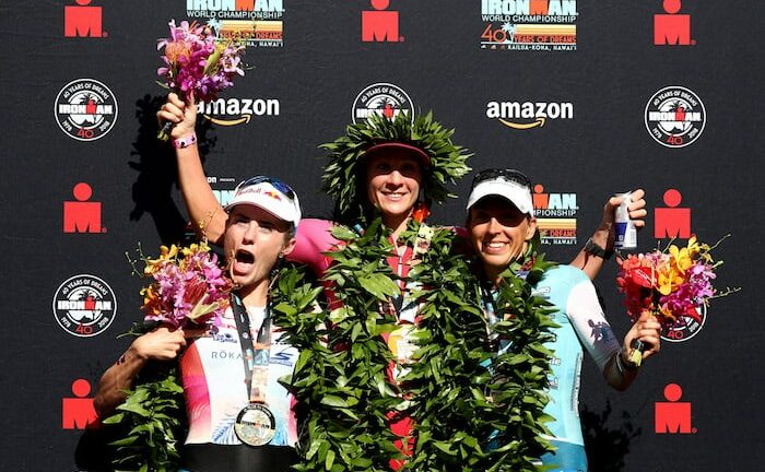 KAILUA KONA, HI - OCTOBER 13: Lucy Charles of Great Britain (second), Daniela Ryf of Switzerland (first) and Anne Haug of Germany (third) celebrate after the IRONMAN World Championships brought to you by Amazon on October 13, 2018 in Kailua Kona, Hawaii. (Photo by Al Bello/Getty Images for IRONMAN)