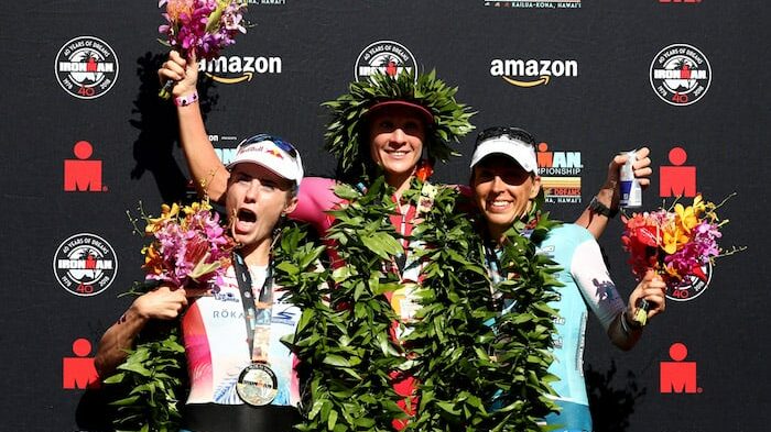 KAILUA KONA, HI - OCTOBER 13: Lucy Charles of Great Britain (second), Daniela Ryf of Switzerland (first) and Anne Haug of Germany (third) celebrate after the IRONMAN World Championships brought to you by Amazon on October 13, 2018 in Kailua Kona, Hawaii. (Photo by Al Bello/Getty Images for IRONMAN)
