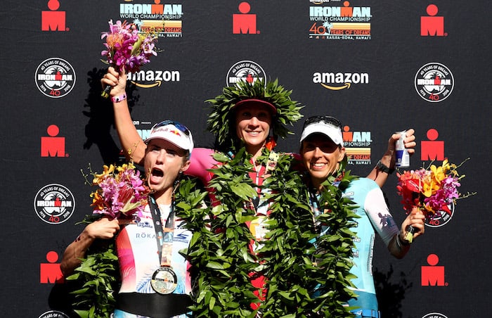 KAILUA KONA, HI - OCTOBER 13: Lucy Charles of Great Britain (second), Daniela Ryf of Switzerland (first) and Anne Haug of Germany (third) celebrate after the IRONMAN World Championships brought to you by Amazon on October 13, 2018 in Kailua Kona, Hawaii. (Photo by Al Bello/Getty Images for IRONMAN)