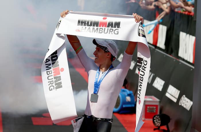 HAMBURG, GERMANY - JULY 28: Kristian Hogenhaug of Denmark celebrates winning Ironman Hamburg on July 28, 2019 in Hamburg, Germany. (Photo by Nigel Roddis/Getty Images for IRONMAN)