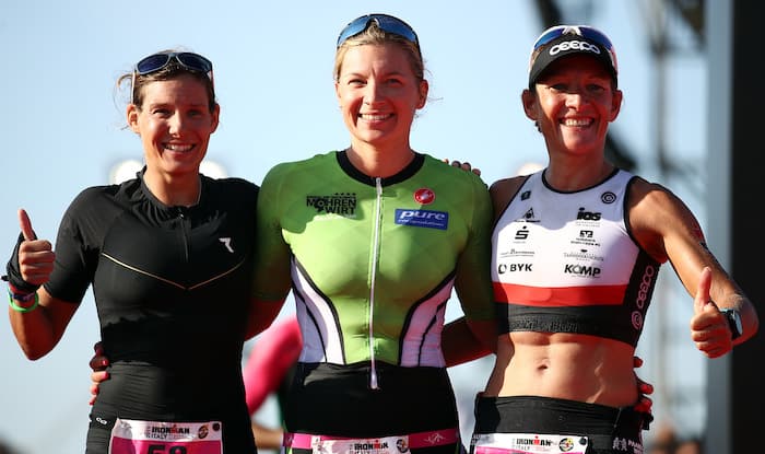 CERVIA, ITALY - SEPTEMBER 21: (l-r) Jenny Schultz, Caroline Lehrieder and Mareen Hufe pose at the finish line on the women's IRONMAN Italy on September 21, 2019 in Cervia, Italy. (Photo by Bryn Lennon/Getty Images for IRONMAN)