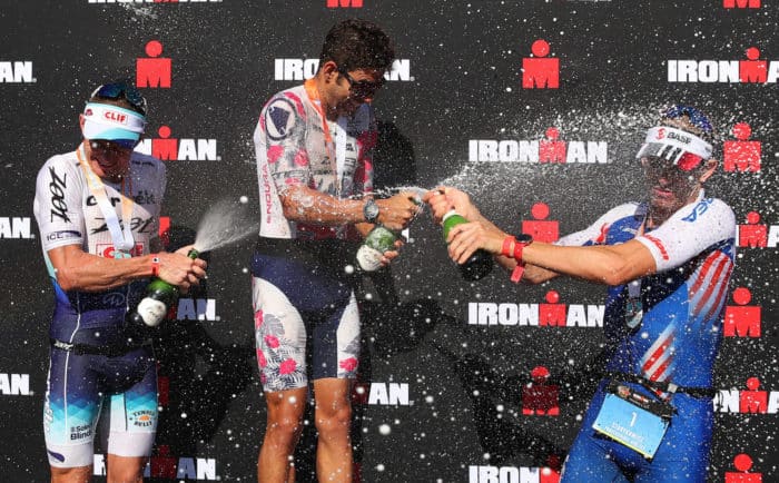 PANAMA CITY, FLORIDA - NOVEMBER 02: (L-R) Ben Hoffman, second place, Joe Skipper, first place and Andrew Starykowicz, third place celebrate their podium finish at the Ironman Florida on November 02, 2019 in Panama City, Florida. (Photo by Gregory Shamus/Getty Images)