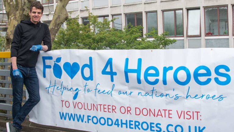 British triathlete Jonny Brownlee stood outside Huddersfield Royal Infirmary preparing to deliver the 100,000th meal for NHS staff made by charity Food4Heroes set up by Amanda Guest of Guest Dining during COVID-19 outbreak. They provide free meals to hospital staff to ensure that they have healthy food to eat on shift.
