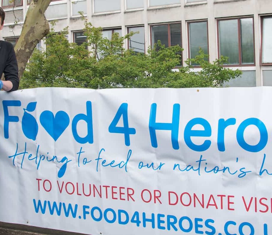 British triathlete Jonny Brownlee stood outside Huddersfield Royal Infirmary preparing to deliver the 100,000th meal for NHS staff made by charity Food4Heroes set up by Amanda Guest of Guest Dining during COVID-19 outbreak. They provide free meals to hospital staff to ensure that they have healthy food to eat on shift.