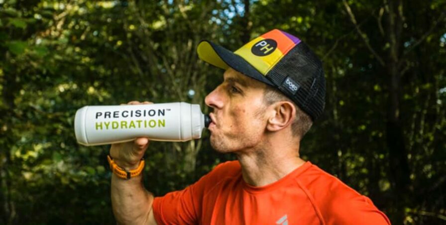 Athlete drinking water post race staying hydrated 
Precision Hydration / Andy Blow