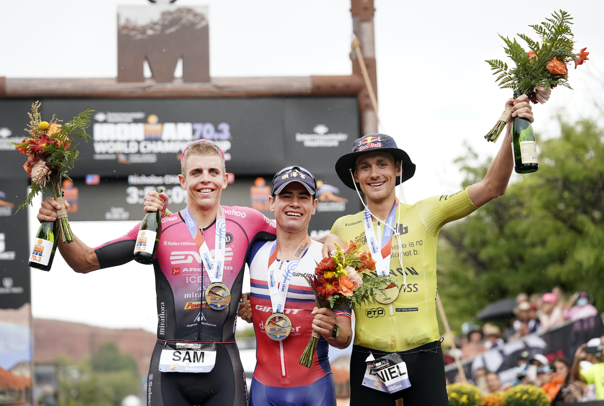 ST GEORGE, UTAH - SEPTEMBER 18: Men's Pro portion winners first place Gustav Iden of Norway, (middle) second place Sam Long of the United States (left) and third place Daniel Baekkegard of Switzerland (right) pose during the IRONMAN 70.3 World Championship on September 18, 2021 in St George, Utah.