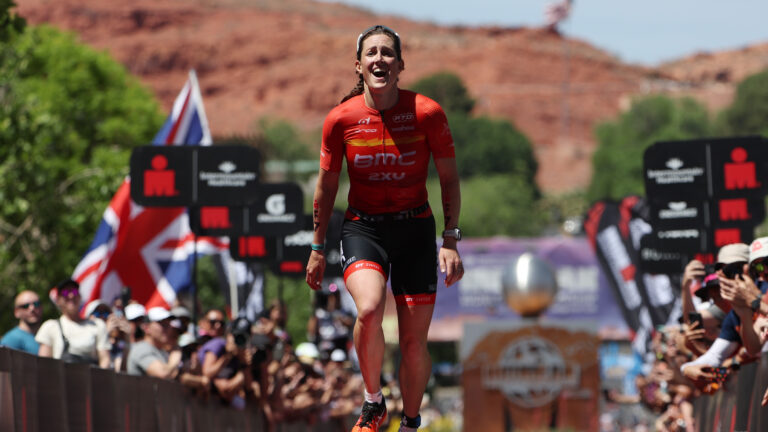 ST GEORGE, UTAH - MAY 07: Kat Matthews of Great Britain celebrates after crossing the finish line to place second in the 2021 IRONMAN World Championships on May 07, 2022 in St George, Utah. (Photo by Tom Pennington/Getty Images for IRONMAN)