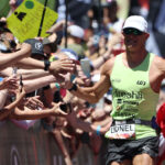 ST GEORGE, UTAH - MAY 07: Lionel Sanders of Canada reacts as he approaches the finish line to place second during the 2021 IRONMAN World Championships on May 07, 2022 in St George, Utah. (Photo by Tom Pennington/Getty Images for IRONMAN)