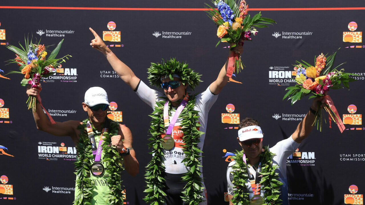 ST GEORGE, UTAH - MAY 07: (L-R) Second place finisher Lionel Sanders of Canada, first place winner Kristian Blummenfelt of Norway and third place finisher Braden Currie of Australia celebrate on the podium after the 2021 IRONMAN World Championships on May 07, 2022 in St George, Utah. (Photo by Sean M. Haffey/Getty Images for IRONMAN)