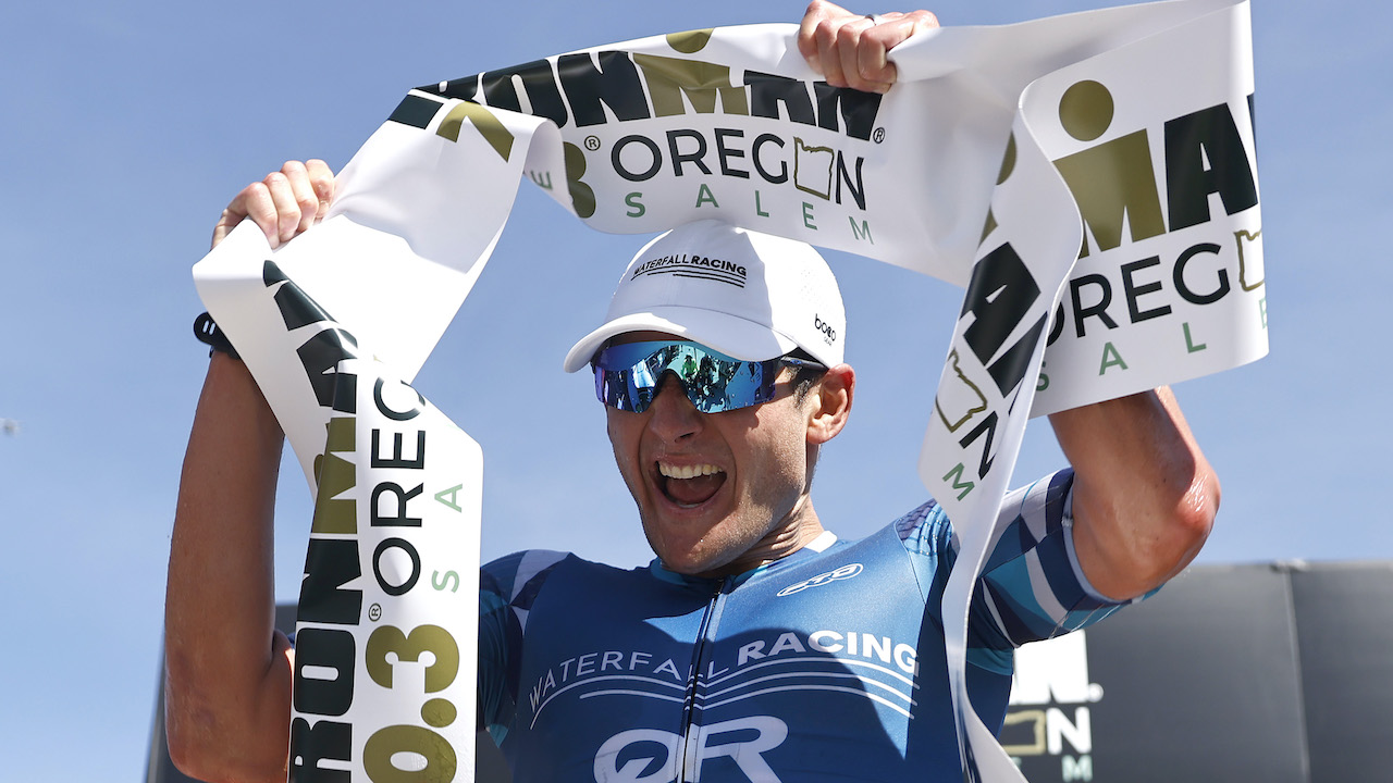 SALEM, OREGON - JULY 10: Justin Metzler celebrates as he finishes in first place IRONMAN 70.3 Oregon on July 10, 2022 in Salem, Oregon. (Photo by Michael Owens/Getty Images for IRONMAN)