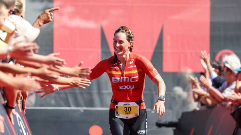 CARDIFF, WALES - AUGUST 07: Kat Matthews of Britain celebrates winning the women’s race at IRONMAN 70.3 Swansea on August 7, 2022 in Cardiff, United Kingdom. (Photo by Nigel Roddis/Getty Images for IRONMAN)