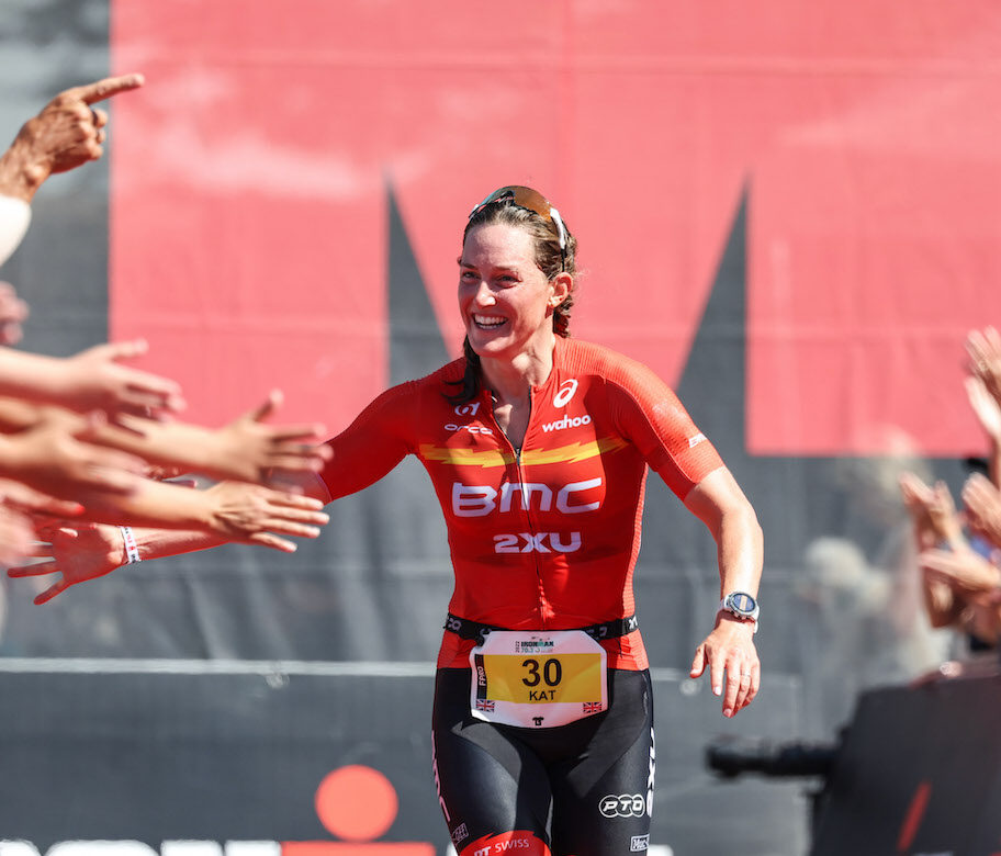 CARDIFF, WALES - AUGUST 07: Kat Matthews of Britain celebrates winning the women’s race at IRONMAN 70.3 Swansea on August 7, 2022 in Cardiff, United Kingdom. (Photo by Nigel Roddis/Getty Images for IRONMAN)