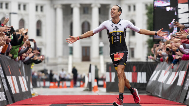 MADISON, WI - SEPTEMBER 08: Emilio Aguayo Munoz of Spain celebrates as he approaches the finish line to win the IRONMAN Wisconsin on September 8, 2019 in Madison, Wisconsin. The IRONMAN Wisconsin triathlon returns to the university town of Madison where participants from around the world converge for the mid-western race through southern Wisconsin. (Photo by Patrick McDermott/Getty Images for IRONMAN)