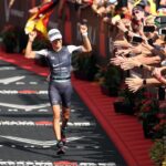 KAILUA KONA, HAWAII - OCTOBER 06: Anne Haug of Germany celebrates after finishing third in the Ironman World Championships on October 06, 2022 in Kailua Kona, Hawaii. (Photo by Ezra Shaw/Getty Images for IRONMAN)