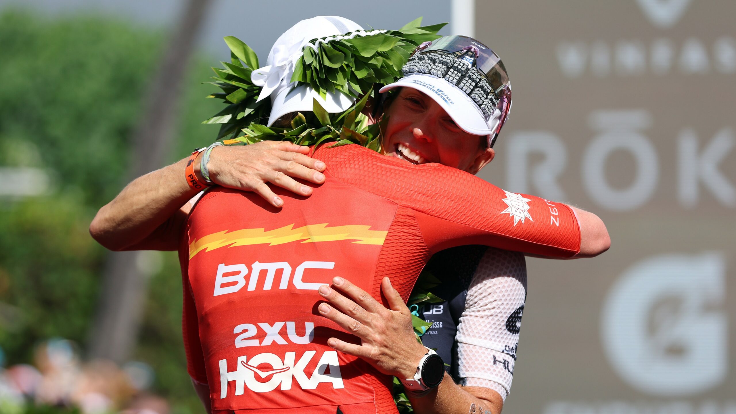 KAILUA KONA, HAWAII - OCTOBER 06: Chelsea Sodaro hugs Anne Haug of Germany after finishing first and third in the Ironman World Championships on October 06, 2022 in Kailua Kona, Hawaii. (Photo by Tom Pennington/Getty Images for IRONMAN)