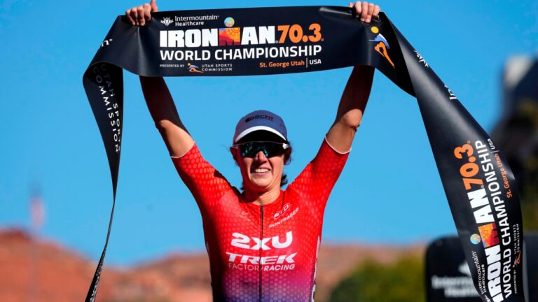 ST GEORGE, UTAH - OCTOBER 28: Taylor Knibb of the United States celebrates after finishing in first place during the IRONMAN 70.3 World Championship on October 28, 2022 in St George, Utah. (Photo by Patrick McDermott/Getty Images for IRONMAN)